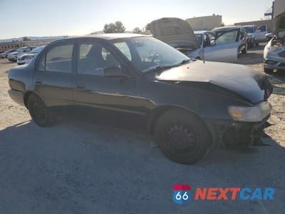 Czwarte zdjęcie samochodu z boku: 1997 TOYOTA COROLLA BASE VIN:1NXBA02E0VZ636542 - miniatura