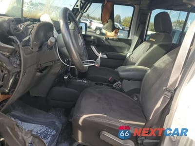 Zdjęcie 7 z 13 samochodu: 2014 JEEP WRANGLER UNLIMITED SAHARA VIN:1C4BJWEG0EL233817 - miniatura