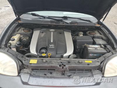 Zdjęcie 12 z 15 samochodu: 2005 HYUNDAI SANTA FE GLS VIN:KM8SC73E55U872430 - miniatura