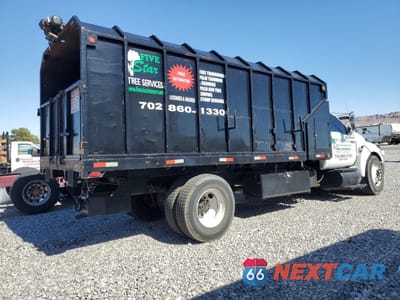 Czwarte zdjęcie samochodu z boku: 2008 FORD F650 SUPER DUTY CHIPPER TRUCK VIN:3FRNF65B38V656314 - miniatura