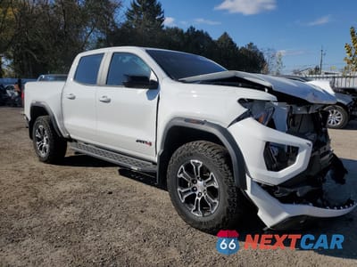 Czwarte zdjęcie samochodu z boku: 2023 GMC CANYON AT4 VIN:1GTP6DEK5P1241393 - miniatura