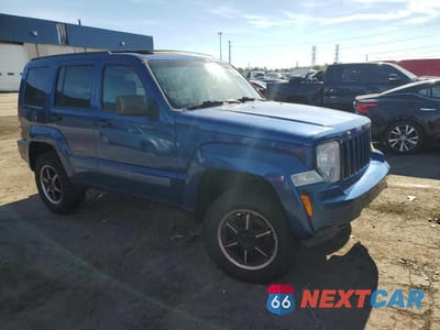 Czwarte zdjęcie samochodu z boku: 2010 JEEP LIBERTY SPORT VIN:1J4PN2GK3AW142449 - miniatura