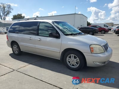 Czwarte zdjęcie samochodu z boku: 2005 FORD FREESTAR SEL VIN:2FMZA52265BA92359 - miniatura