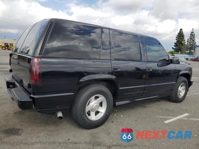 Trzecie zdjęcie samochodu z tyłu: 2000 CHEVROLET TAHOE C1500 VIN:1GNEC13RXYR113305 - miniatura