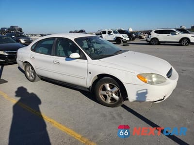 Czwarte zdjęcie samochodu z boku: 2002 FORD TAURUS SES VIN:1FAFP55292A206188 - miniatura