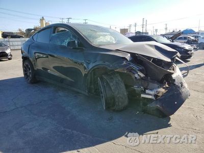 Czwarte zdjęcie samochodu z boku: 2022 TESLA MODEL Y VIN:7SAYGDEE8NF351356 - miniatura