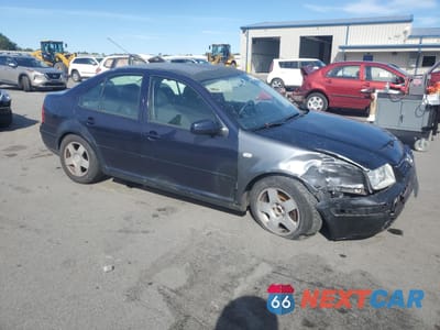 Czwarte zdjęcie samochodu z boku: 1999 VOLKSWAGEN JETTA GLS VIN:3VWSC29M2XM012981 - miniatura