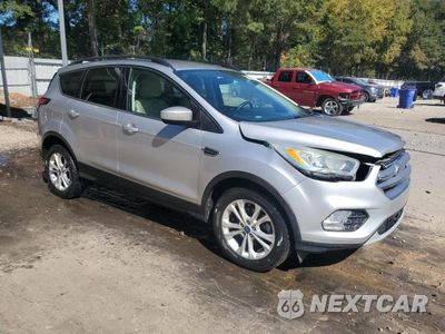 Czwarte zdjęcie samochodu z boku: 2017 FORD ESCAPE SE VIN:1FMCU0GD8HUC18360 - miniatura