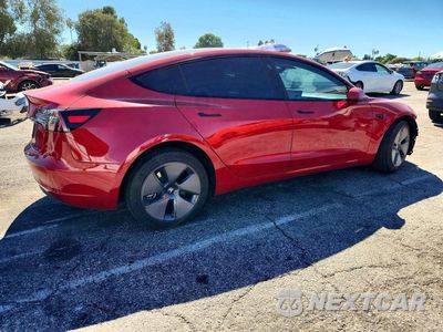 Trzecie zdjęcie samochodu z tyłu: 2023 TESLA MODEL 3 VIN:5YJ3E1EA8PF431994 - miniatura