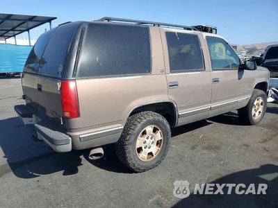 Trzecie zdjęcie samochodu z tyłu: 1997 GMC YUKON VIN:1GKEK13R4VJ737496 - miniatura