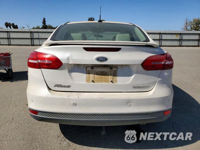 Zdjęcie 6 z 12 samochodu: 2017 FORD FOCUS TITANIUM VIN:1FADP3J22HL260740 - miniatura
