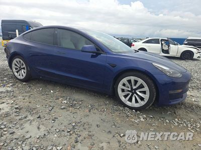 Czwarte zdjęcie samochodu z boku: 2023 TESLA MODEL 3 VIN:5YJ3E1EAXPF688185 - miniatura