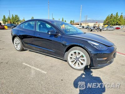 Czwarte zdjęcie samochodu z boku: 2022 TESLA MODEL 3 VIN:5YJ3E1EB5NF185069 - miniatura