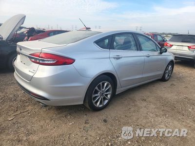Trzecie zdjęcie samochodu z tyłu: 2017 FORD FUSION SE HYBRID VIN:3FA6P0LU1HR385073 - miniatura