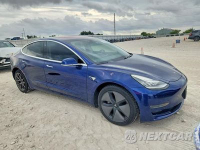 Czwarte zdjęcie samochodu z boku: 2018 TESLA MODEL 3 VIN:5YJ3E1EB9JF115164 - miniatura