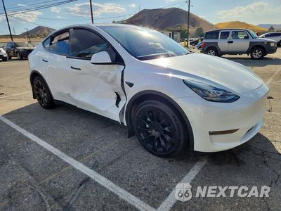 Czwarte zdjęcie samochodu z boku: 2021 TESLA MODEL Y VIN:5YJYGAEE8MF267791 - miniatura