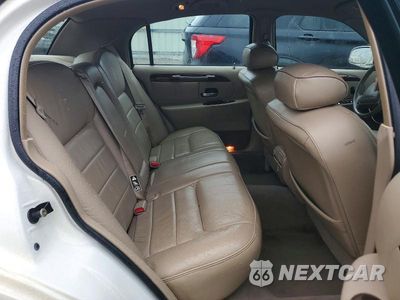 Zdjęcie 10 z 12 samochodu: 2000 LINCOLN TOWN CAR EXECUTIVE VIN:1LNHM81W9YY869911 - miniatura