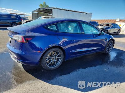 Trzecie zdjęcie samochodu z tyłu: 2022 TESLA MODEL 3 VIN:5YJ3E1EA7NF289263 - miniatura