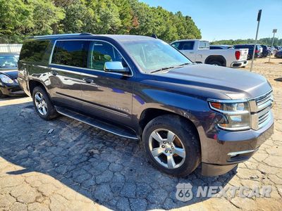 Czwarte zdjęcie samochodu z boku: 2017 CHEVROLET SUBURBAN C1500 PREMIER VIN:1GNSCJKC6HR177521 - miniatura