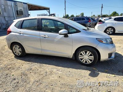 Czwarte zdjęcie samochodu z boku: 2015 HONDA FIT LX VIN:3HGGK5H50FM723909 - miniatura
