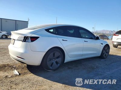Trzecie zdjęcie samochodu z tyłu: 2023 TESLA MODEL 3 VIN:5YJ3E1EA4PF418319 - miniatura