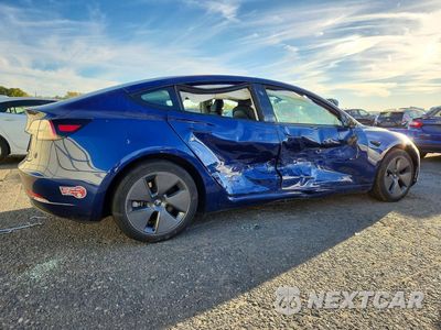 Trzecie zdjęcie samochodu z tyłu: 2023 TESLA MODEL 3 VIN:5YJ3E1EB9PF698814 - miniatura