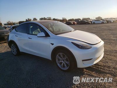 Czwarte zdjęcie samochodu z boku: 2023 TESLA MODEL Y VIN:7SAYGAEE7PF979703 - miniatura
