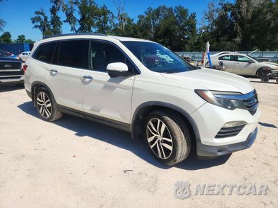 Czwarte zdjęcie samochodu z boku: 2016 HONDA PILOT TOURING VIN:5FNYF5H90GB023341 - miniatura