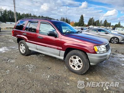 Czwarte zdjęcie samochodu z boku: 2000 JEEP GRAND CHEROKEE LAREDO VIN:1J4GW48S6YC122439 - miniatura