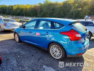 Drugie zdjęcie samochodu z przodu: 2014 FORD FOCUS TITANIUM VIN:1FADP3N22EL338603 - miniatura