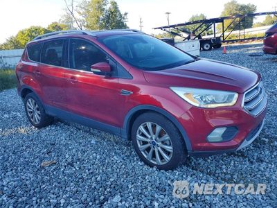 Czwarte zdjęcie samochodu z boku: 2017 FORD ESCAPE TITANIUM VIN:1FMCU0J93HUC43171 - miniatura