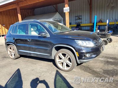 Czwarte zdjęcie samochodu z boku: 2014 VOLKSWAGEN TIGUAN S VIN:WVGBV3AX6EW059142 - miniatura