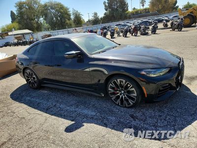 Czwarte zdjęcie samochodu z boku: 2024 BMW M440I GRAN COUPE VIN:WBA63AW01RFR48560 - miniatura