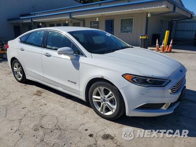 Czwarte zdjęcie samochodu z boku: 2018 FORD FUSION SE HYBRID VIN:3FA6P0LU7JR129896 - miniatura