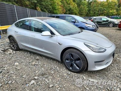 Czwarte zdjęcie samochodu z boku: 2018 TESLA MODEL 3 VIN:5YJ3E1EA2JF016564 - miniatura
