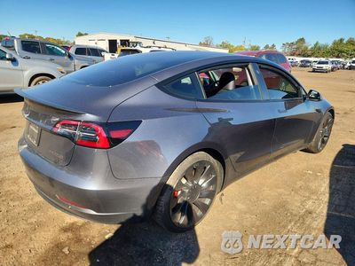 Trzecie zdjęcie samochodu z tyłu: 2023 TESLA MODEL 3 VIN:5YJ3E1EC9PF685828 - miniatura