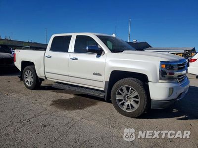 Czwarte zdjęcie samochodu z boku: 2017 CHEVROLET SILVERADO K1500 HIGH COUNTRY VIN:3GCUKTECXHG484699 - miniatura