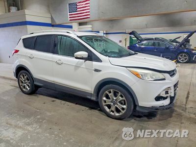 Czwarte zdjęcie samochodu z boku: 2015 FORD ESCAPE TITANIUM VIN:1FMCU0J98FUA88131 - miniatura