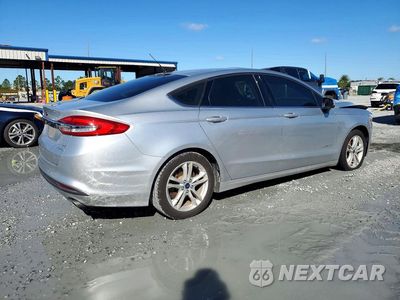 Trzecie zdjęcie samochodu z tyłu: 2018 FORD FUSION SE HYBRID VIN:3FA6P0LU9JR124070 - miniatura