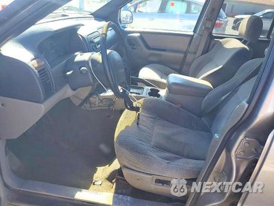 Zdjęcie 7 z 13 samochodu: 1999 JEEP GRAND CHEROKEE LAREDO VIN:1J4GW58S4XC600250 - miniatura