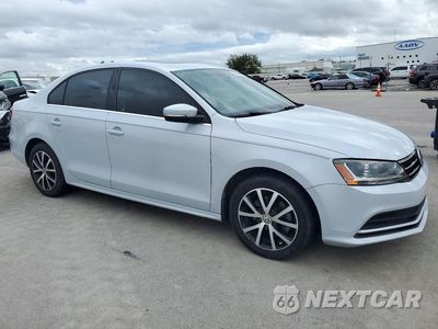 Czwarte zdjęcie samochodu z boku: 2017 VOLKSWAGEN JETTA SE VIN:3VWDB7AJ7HM382139 - miniatura