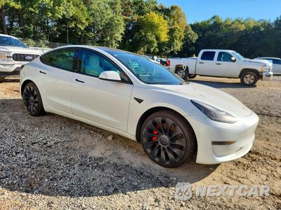 Czwarte zdjęcie samochodu z boku: 2022 TESLA MODEL 3 VIN:5YJ3E1EC5NF353379 - miniatura