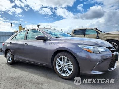 Czwarte zdjęcie samochodu z boku: 2015 TOYOTA CAMRY HYBRID SE VIN:4T1BD1FK7FU163155 - miniatura