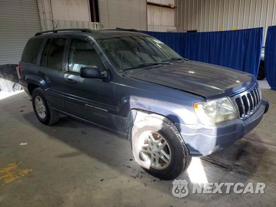 Czwarte zdjęcie samochodu z boku: 2003 JEEP GRAND CHEROKEE LAREDO VIN:1J4GW48N23C555372 - miniatura