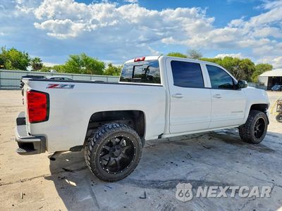 Trzecie zdjęcie samochodu z tyłu: 2017 CHEVROLET SILVERADO K1500 LT VIN:3GCUKREC4HG123326 - miniatura