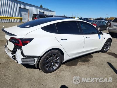 Trzecie zdjęcie samochodu z tyłu: 2023 TESLA MODEL 3 VIN:5YJ3E1EA7PF542567 - miniatura