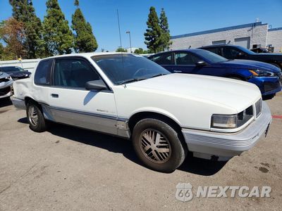 Czwarte zdjęcie samochodu z boku: 1987 PONTIAC GRAND AM LE VIN:1G2NV14U6HC939419 - miniatura