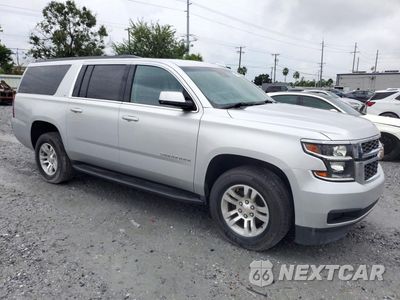 Czwarte zdjęcie samochodu z boku: 2020 CHEVROLET SUBURBAN C1500 LT VIN:1GNSCHKC1LR300451 - miniatura