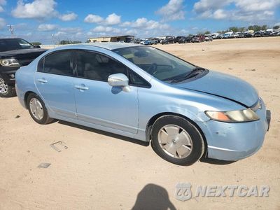 Czwarte zdjęcie samochodu z boku: 2006 HONDA CIVIC HYBRID VIN:JHMFA36256S012531 - miniatura