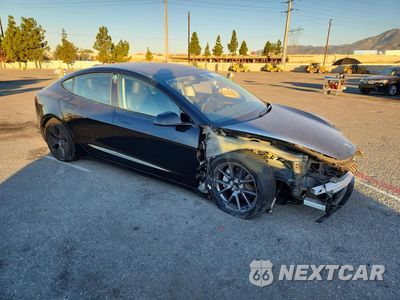 Czwarte zdjęcie samochodu z boku: 2023 TESLA MODEL 3 VIN:5YJ3E1EAXPF643859 - miniatura